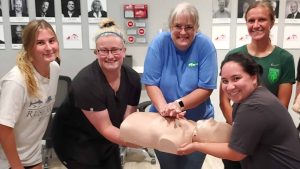Group CPR training session in Clearwater with instructor and students.